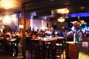 Beautifully lit dining area and stage at 210 Restaurant & Live Music Lounge in Highwood